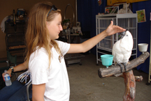 girl petting Umbrella Cockatoo